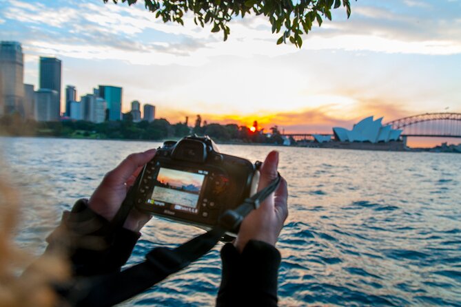 Private Sydney Harbour Sunset Photo Tour & Cruise - Milsons Point: the Bridge arch overhead and Opera House glow at sunset