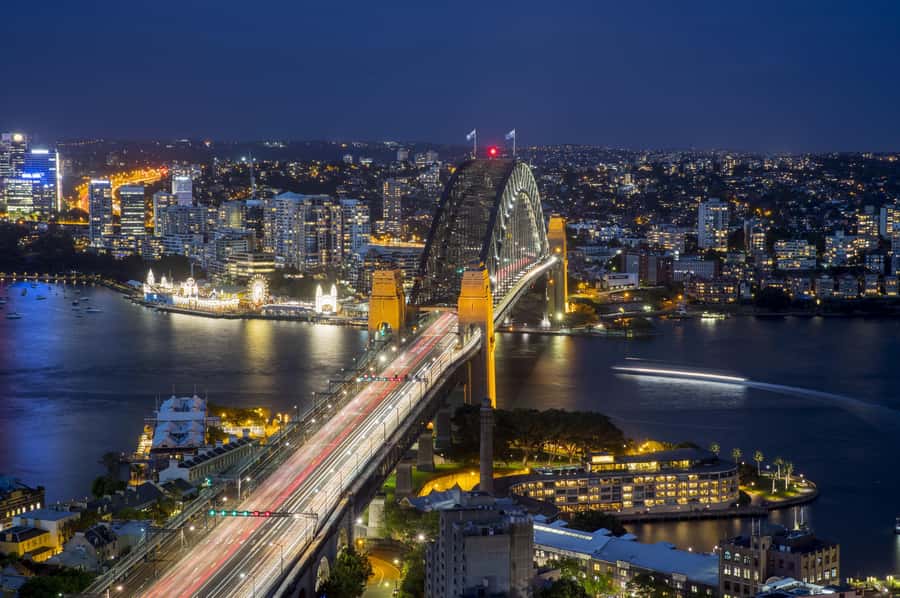 Sydney: Big Bus Panoramic Night Tour by Open-Top Bus - Passing the Opera House and Circular Quay: the classic view, guided